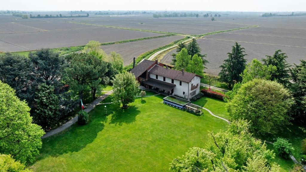 an aerial view of a house in a field at Cascina Brignolo - Casa Bianca in Novara