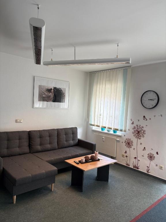 a living room with a couch and a coffee table at Wohnung Weida 2 in Riesa