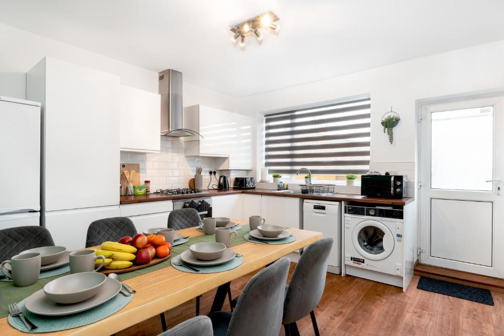 a kitchen with a wooden table with fruit on it at 3 bed house, Free parking 9ppl in Pleasley