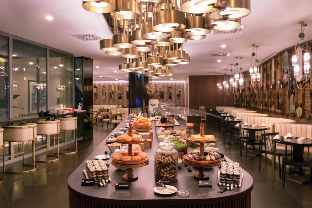 A polished breakfast buffet fills the centre of the hotel restaurant.