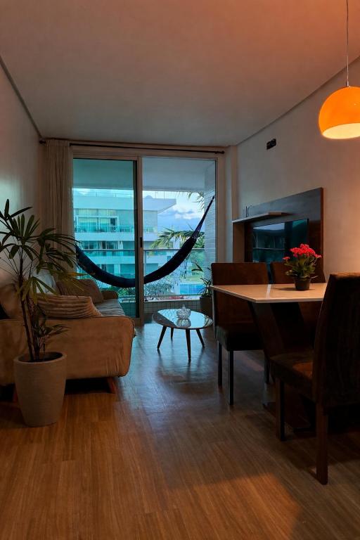 a living room with a couch and a table at Lake view in Brasília
