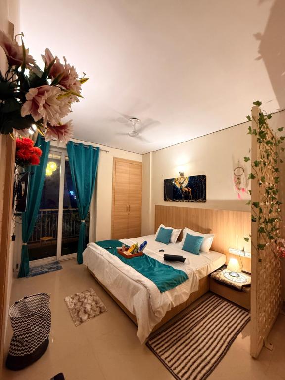 a bedroom with a large bed in a room at Laugh-Tales in Mathura