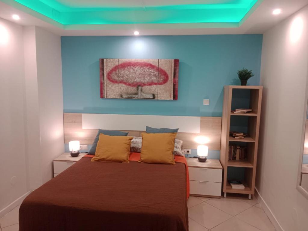 a bedroom with a bed and two night stands at Loft Centrico Bahía 5 in Santander