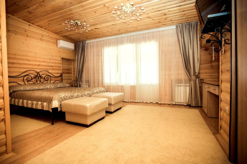 Un pat sau paturi într-o cameră la База отдыха "Форелька"