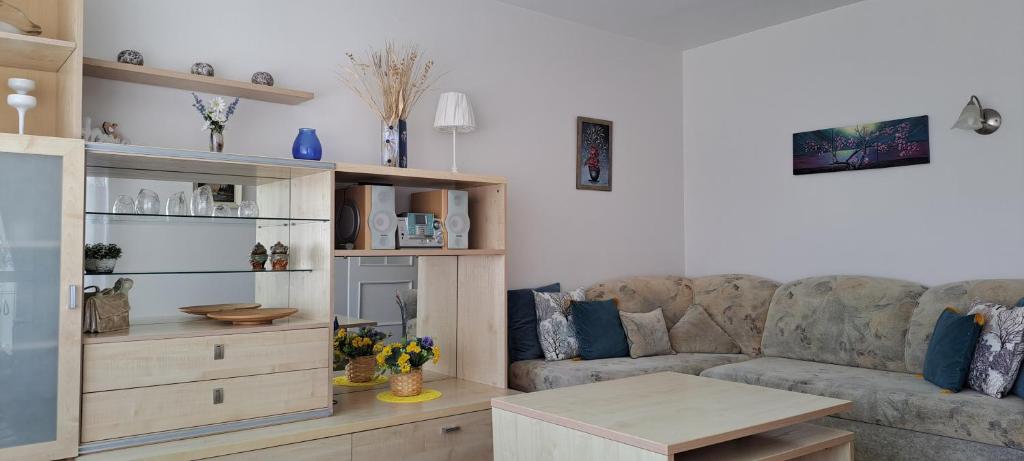 a living room with a couch and a coffee table at Santariškės Apartment in Vilnius