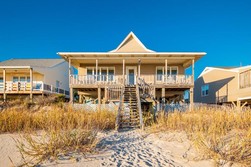 a house on the beach with stairs to the beach at Lady Dune in Oak Island