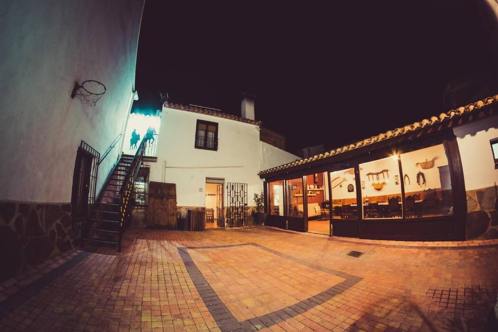 a building with a staircase in front of it at night at Casa&Spa Don Gonzalo in Hoya-Gonzalo