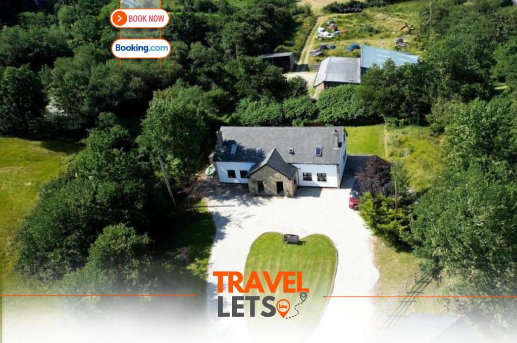 an aerial view of a house with a driveway at Four Bedroom House By Travel Lets Short Term Rental Agency Donegal With Free WiFi in Letterkenny