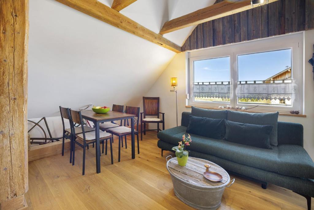 a living room with a couch and a table at Beim Senner in Halblech