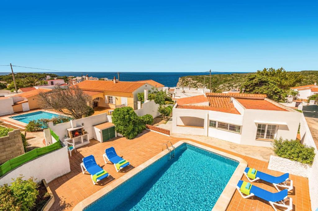 an aerial view of a villa with a swimming pool at Villa San Jose by Villa Plus in Cala en Porter