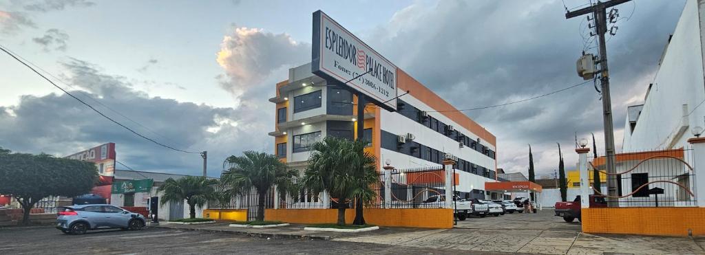 a building with a sign on the side of it at Esplendor Palace Hotel in Vitória da Conquista