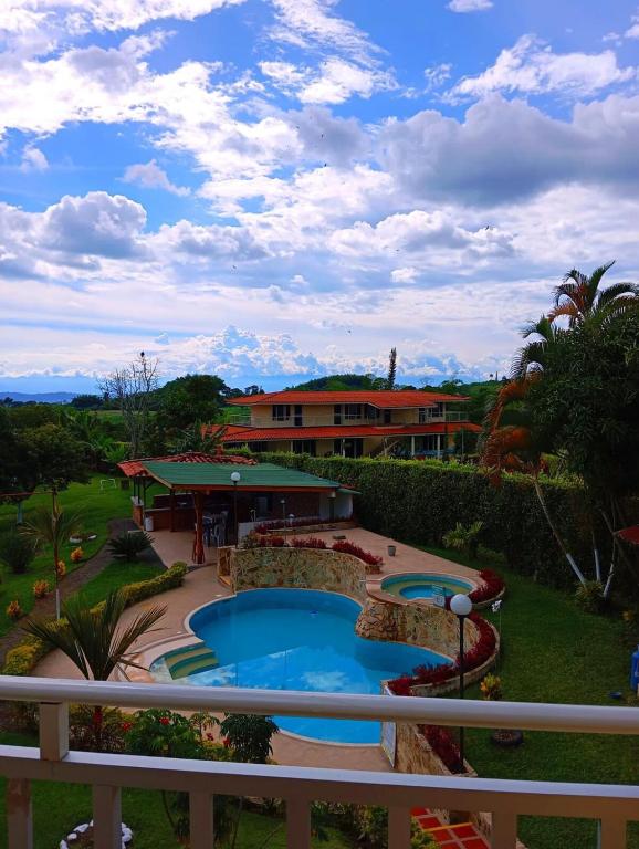 a view of a resort with a swimming pool at Finca el Amanecer - 30P - Pool in Quimbaya