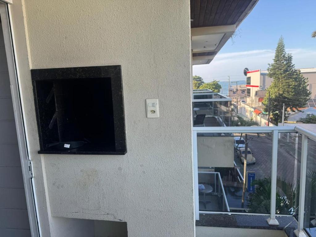 a view of a balcony with a view of a street at Apartamento 70 metros do mar in Florianópolis