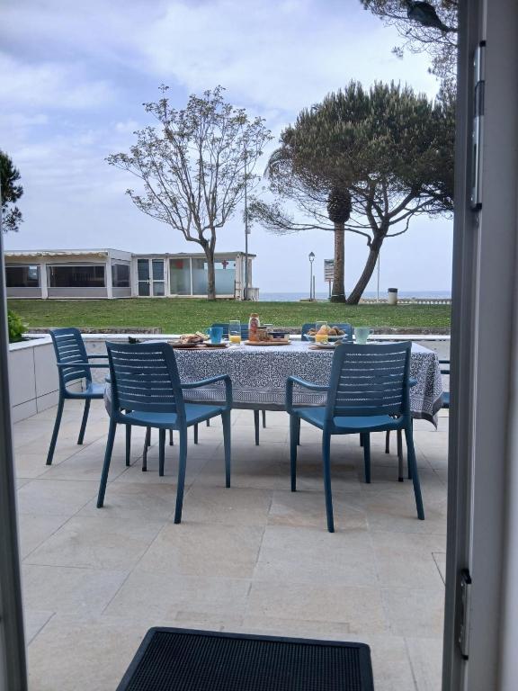 a table and chairs sitting on a patio at El Pinar Beach in Comillas