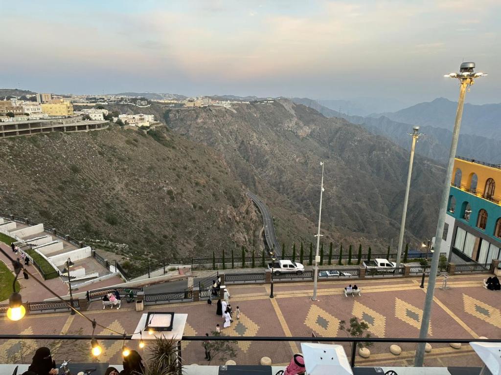 a view of a city with a mountain in the background at كلود فيو in Abha