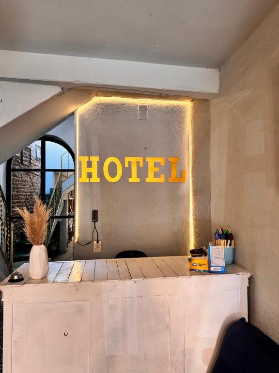 a hotel sign on the wall of a room at Hotel Casa 22 in San Miguel de Allende