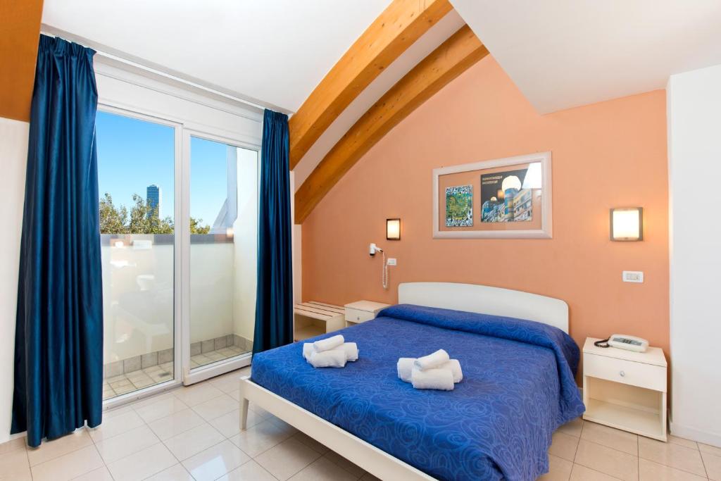 Postel nebo postele na pokoji v ubytování Hotel Sogno