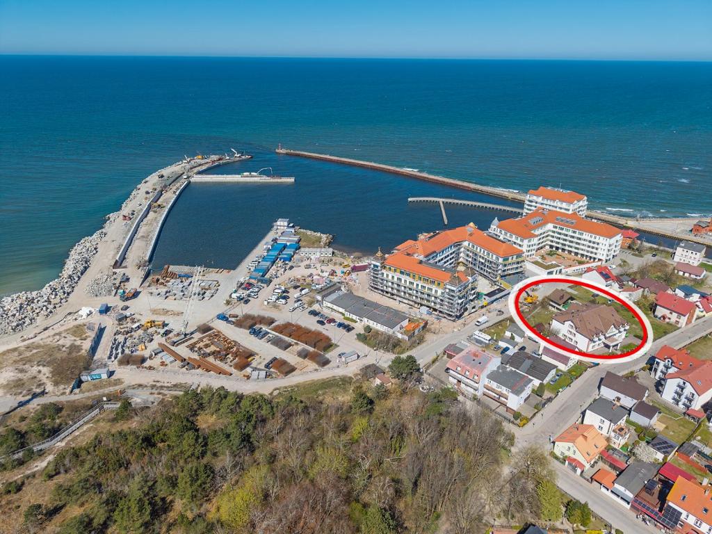 an aerial view of a resort next to the ocean at Villa Anna in Darłowo