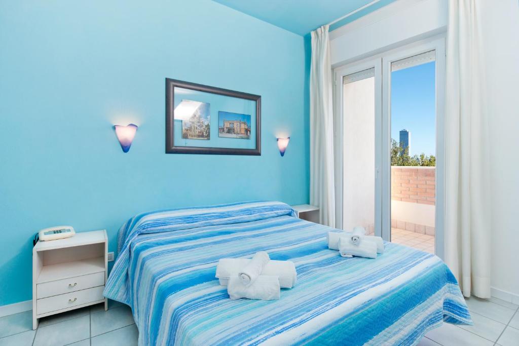 Postel nebo postele na pokoji v ubytování Hotel Sogno
