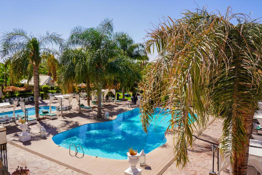 an image of a swimming pool at a resort at Weedan Hotel & Spa Marrakech in Oulad Snaguia