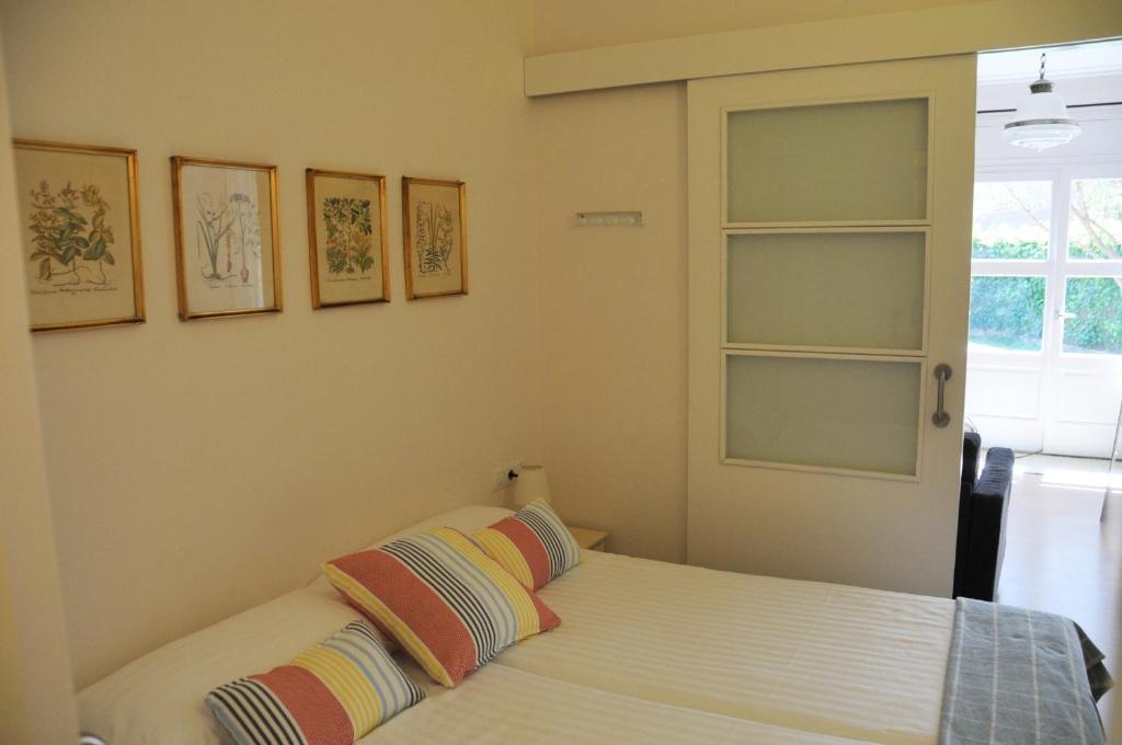 A bed or beds in a room at Tibidabo Apartments