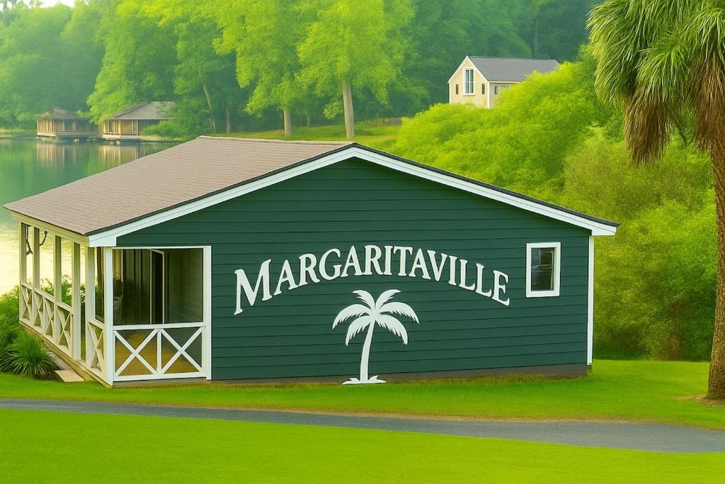 a blue building with a palm tree painted on it at Charming Lake Front Home and Pavilion in Milledgeville