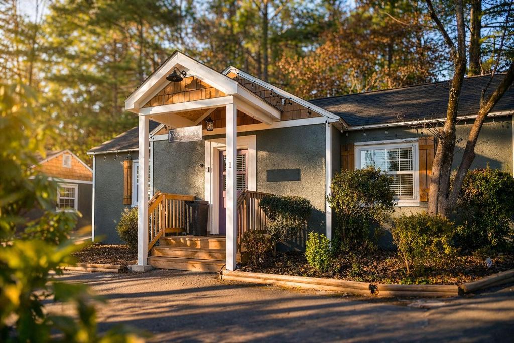 a small house with a porch and a gate at 1- Lookout Mountain Cottage in Lookout Mountain