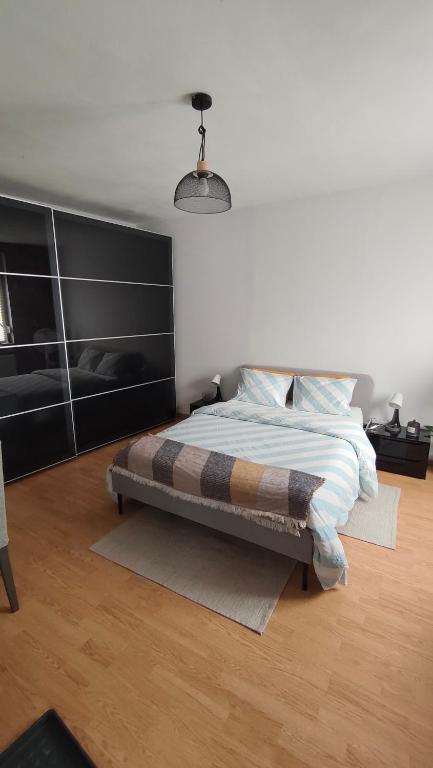 En eller flere senge i et værelse på Chambre 1