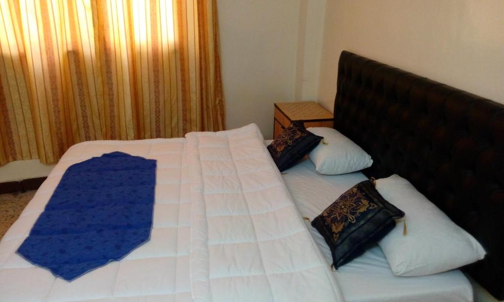 Posteľ alebo postele v izbe v ubytovaní Hamoudah Hotel