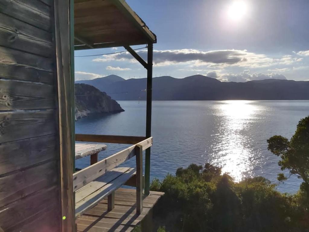 a cabin with a view of a lake at Fitalmios in Methana