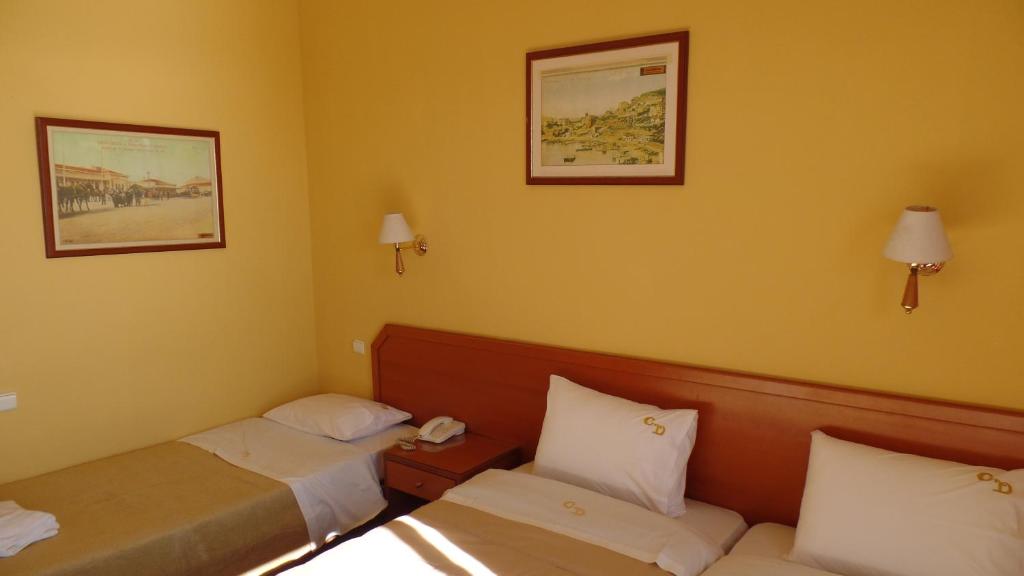 Postel nebo postele na pokoji v ubytování Cavo D' Oro