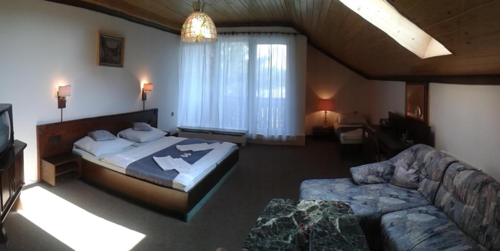 Postel nebo postele na pokoji v ubytování Hotel Pavla Vysočina