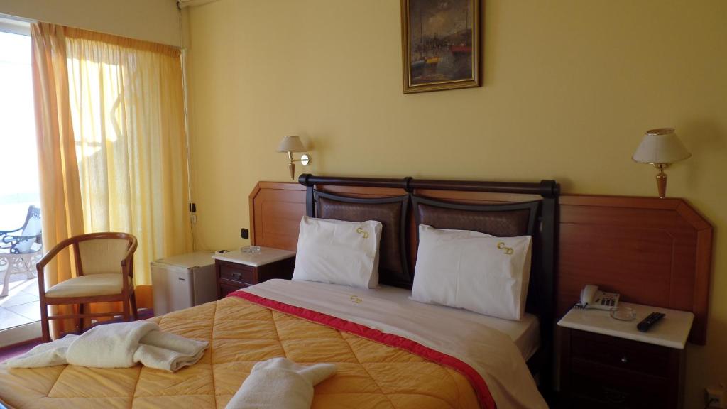 Postel nebo postele na pokoji v ubytování Cavo D' Oro