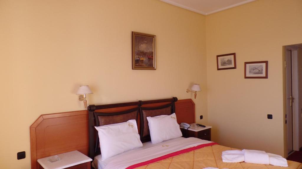 Postel nebo postele na pokoji v ubytování Cavo D' Oro