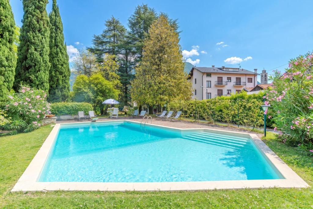 a swimming pool in the yard of a house at Villa Colle in Ossuccio