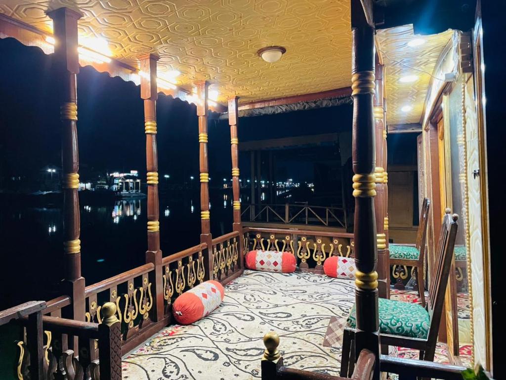 a balcony with a view of the water at FREEDOM houseBoat in Srinagar