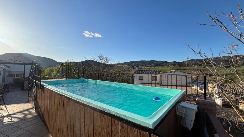 a large swimming pool on a wooden fence at Casa La Cañada by CasaTuristica in Ronda