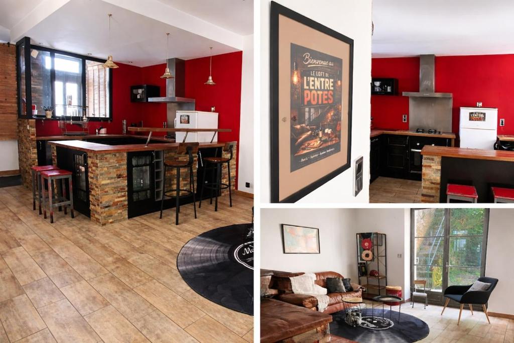 a kitchen and a living room with red walls at Le loft de l'entrepote in Argenton-sur-Creuse