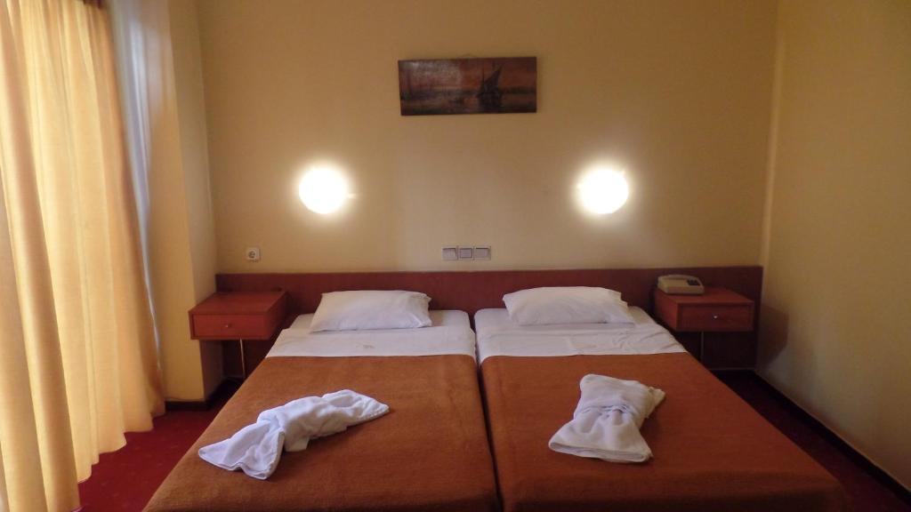 Postel nebo postele na pokoji v ubytování Cavo D' Oro