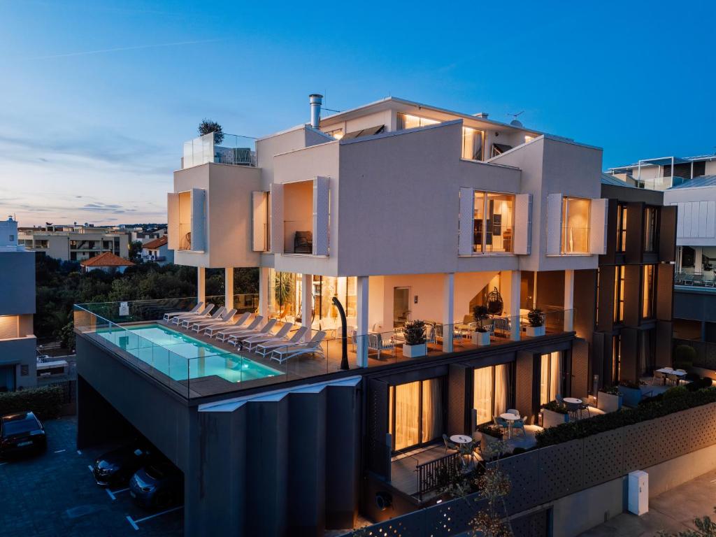 an aerial view of a building with a swimming pool at Dedaj Resort - Villa Auri in Zadar