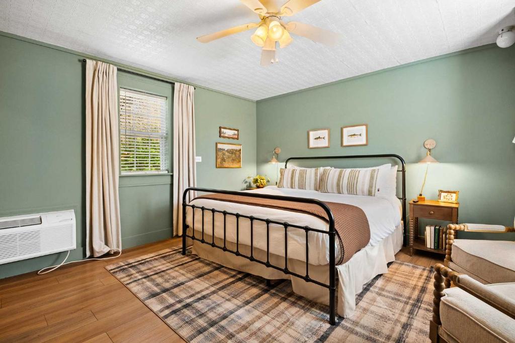 a bedroom with a bed and a ceiling fan at LMI -15- Laurel Falls Room: Summers Night in Lookout Mountain