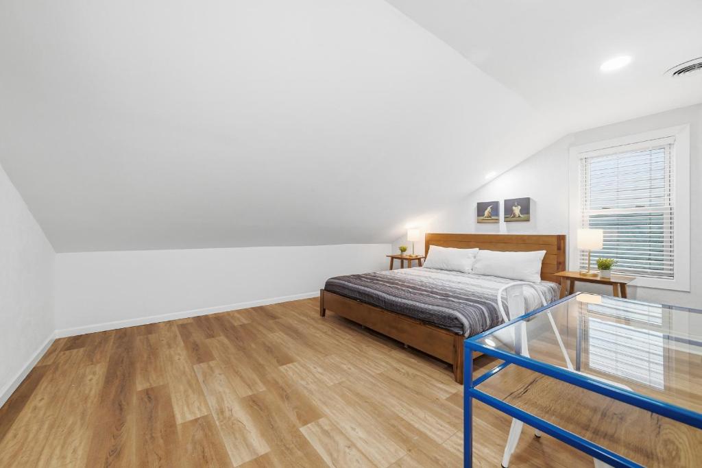 a bedroom with a bed and a glass table at Pittsburgh Millvale E Modern and Quiet Private Bedroom with Shared Bathroom in Pittsburgh