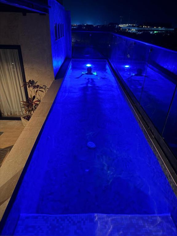 a swimming pool with blue lights on top of a building at PH 3-Bedroom Private Pool in TUK in Tulum