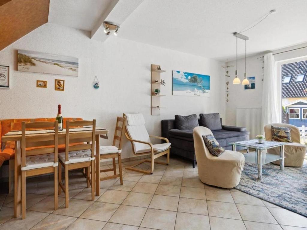 a living room with a couch and a table at Delphin in Pruchten