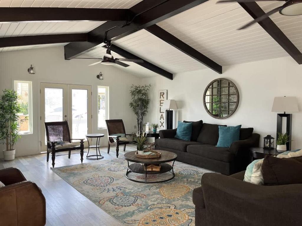 a living room with a couch and a table at 508 Clubhouse in Newport Beach