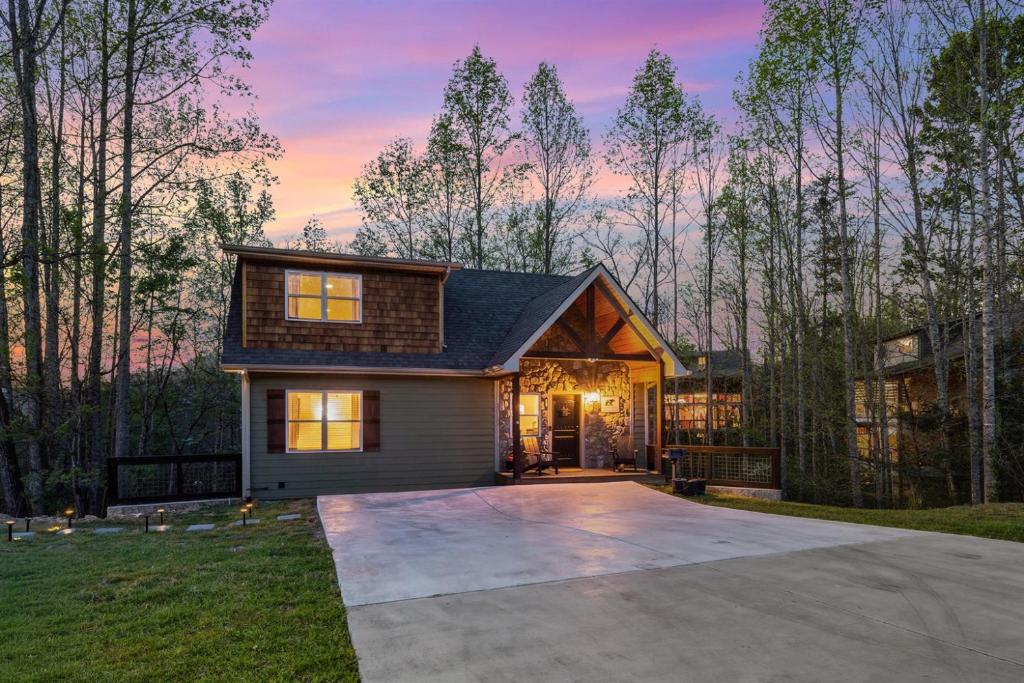 a house with a large driveway in the yard at Grizzly Glam in Gatlinburg