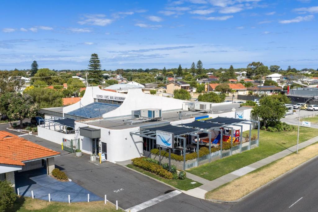 an aerial view of a white building with a parking lot at Hotel Clipper in Rockingham