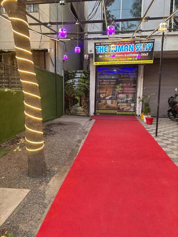 a red carpet entrance to a man shop with a red carpet at The Human Stay in Indore