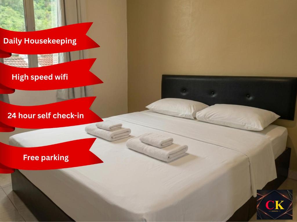 a bed with red arrows showing the different stages of a bedroom at CK Hotel - Self Check In in Lumut