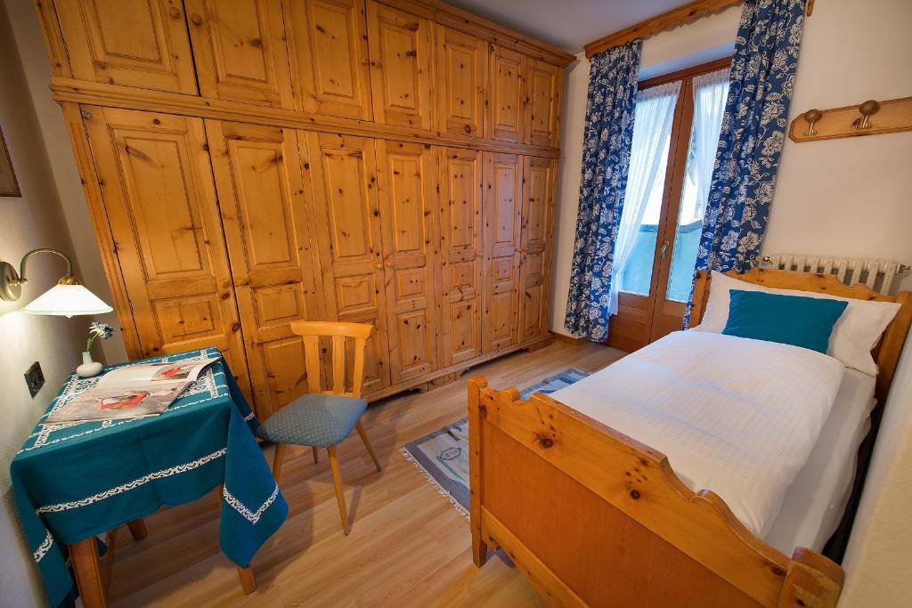Postel nebo postele na pokoji v ubytování Hotel Posta